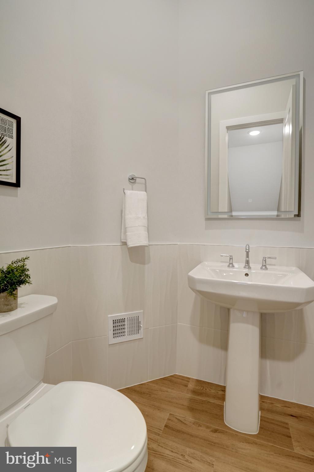2605 Fall Line Street Alexandria, VA 22301 - Photo 17 of 71 a bathroom with a sink a toilet and mirror