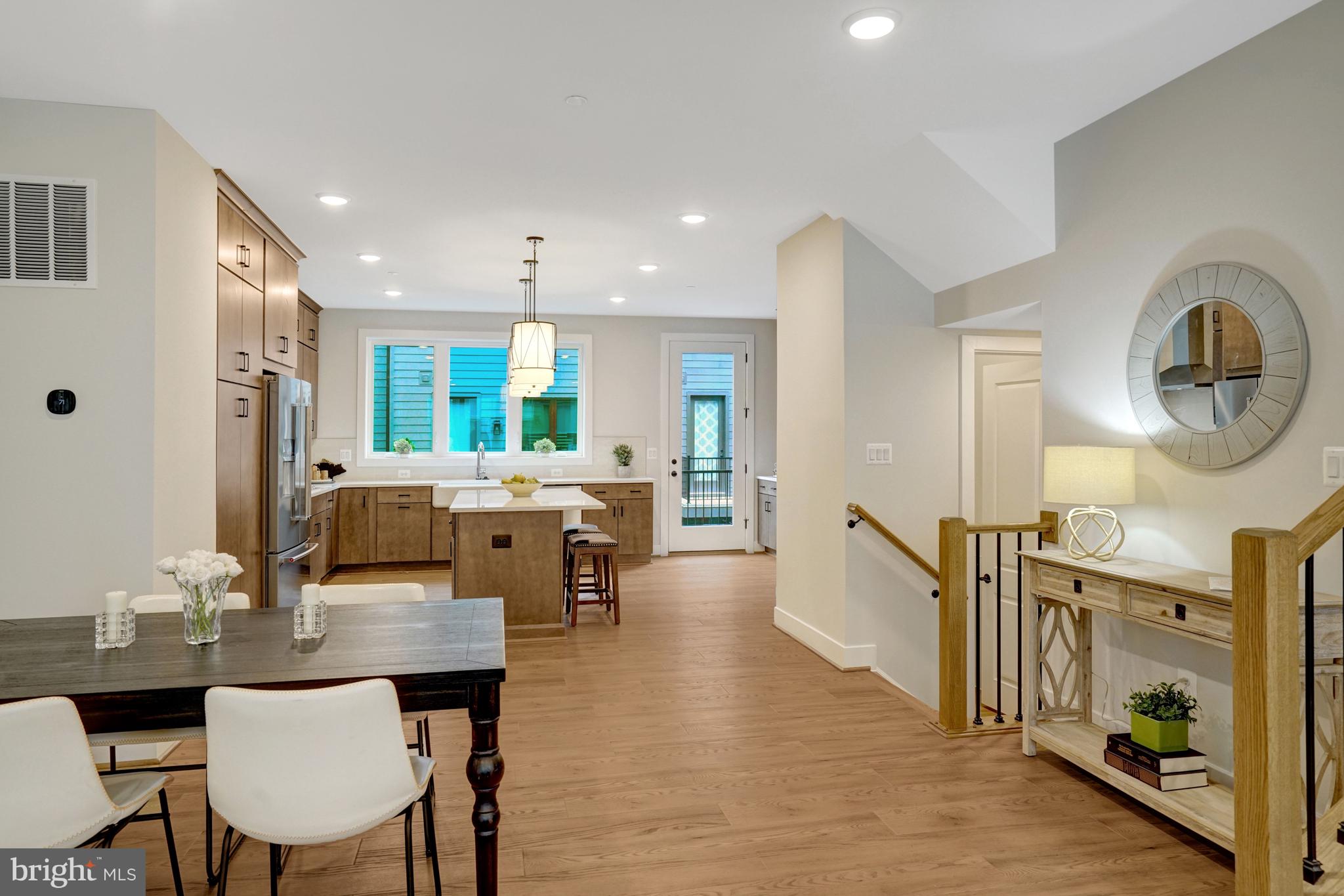 2605 Fall Line Street Alexandria, VA 22301 - Photo 25 of 71 a kitchen with a table and chairs in it