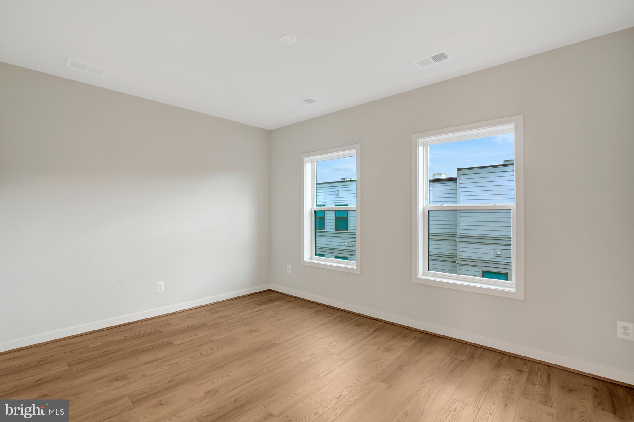 2605 Fall Line Street Alexandria, VA 22301 - Photo 42 of 71 a view of an empty room with wooden floor and window