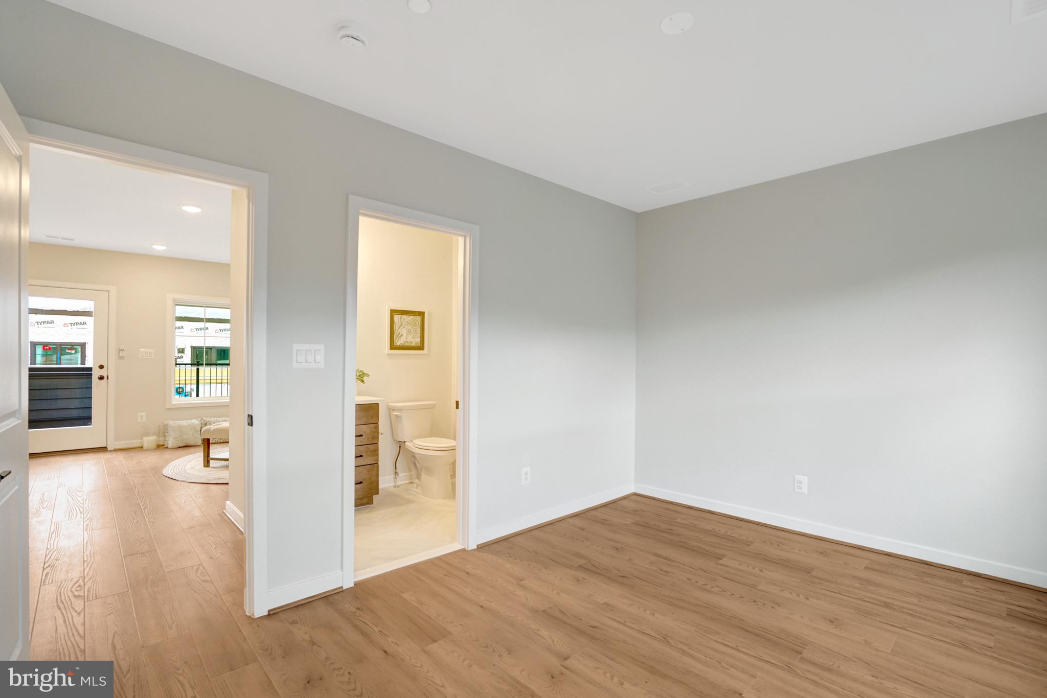 2605 Fall Line Street Alexandria, VA 22301 - Photo 43 of 71 a view of a livingroom with wooden floor and a kitchen