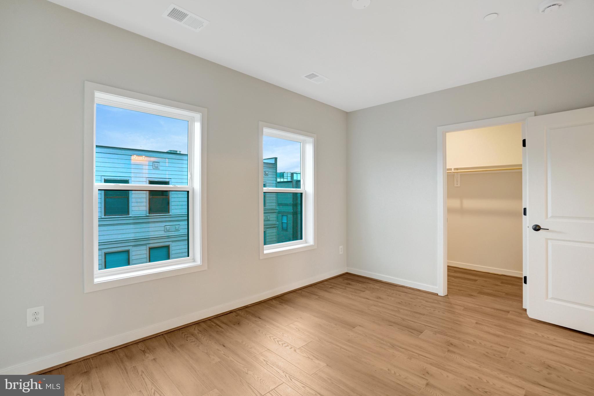 2605 Fall Line Street Alexandria, VA 22301 - Photo 44 of 71 a view of an empty room with window and wooden floor