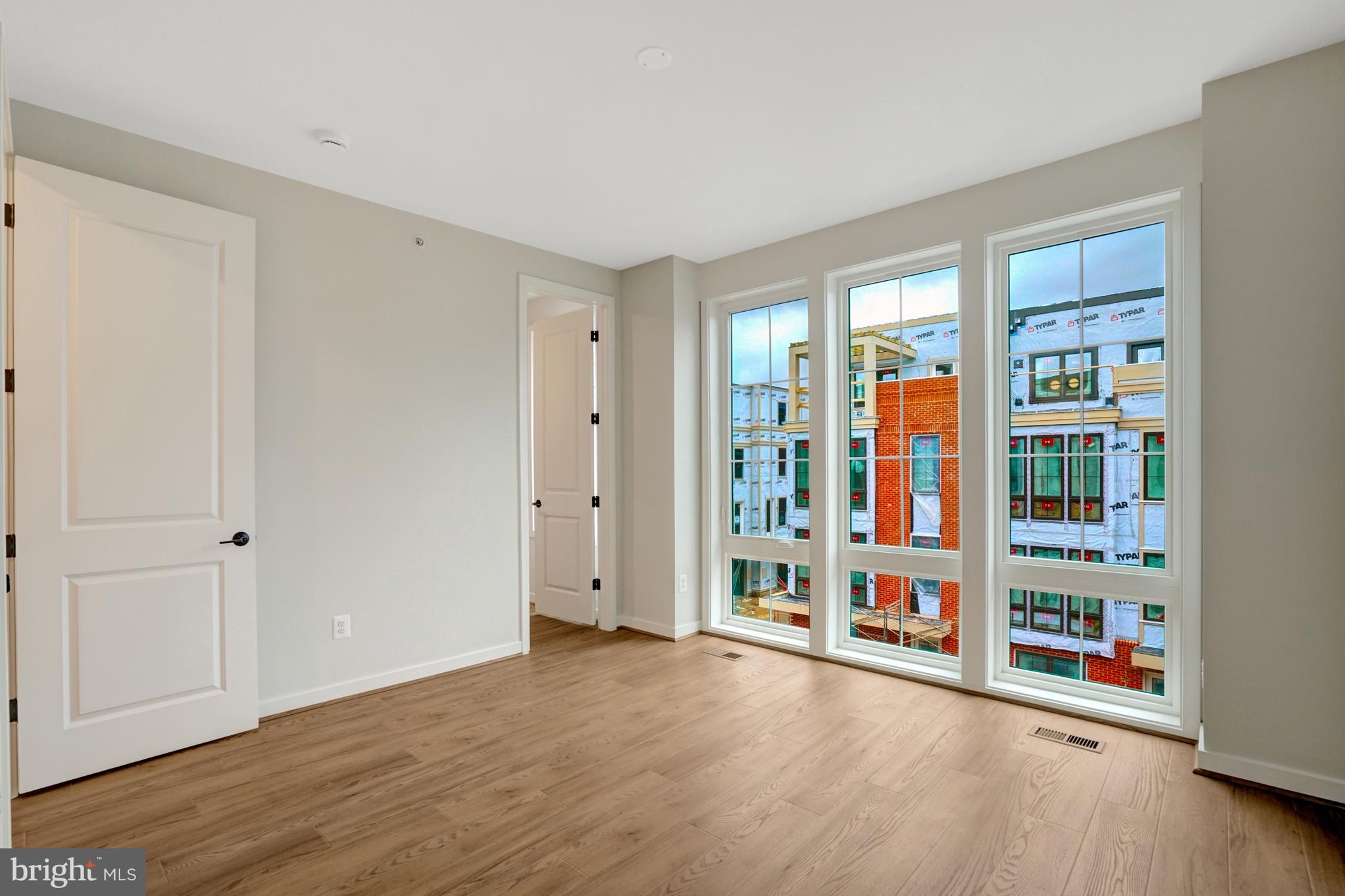 2605 Fall Line Street Alexandria, VA 22301 - Photo 50 of 71 a view of an empty room with window and hardwood floor