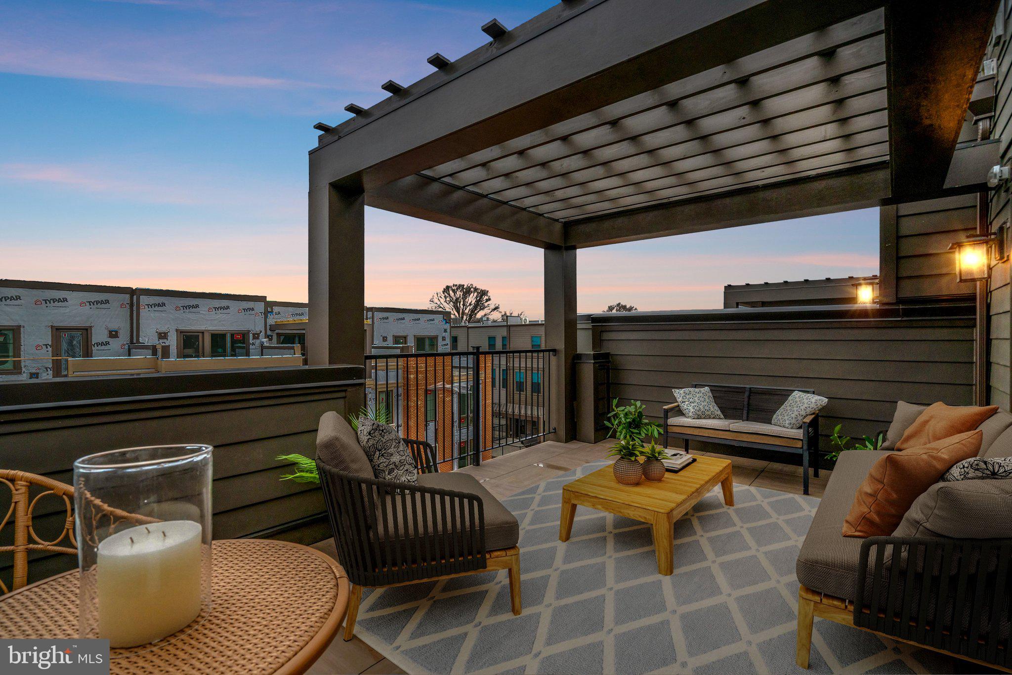 2605 Fall Line Street Alexandria, VA 22301 - Photo 5 of 71 a view of a roof deck with couches potted plants and wooden floor