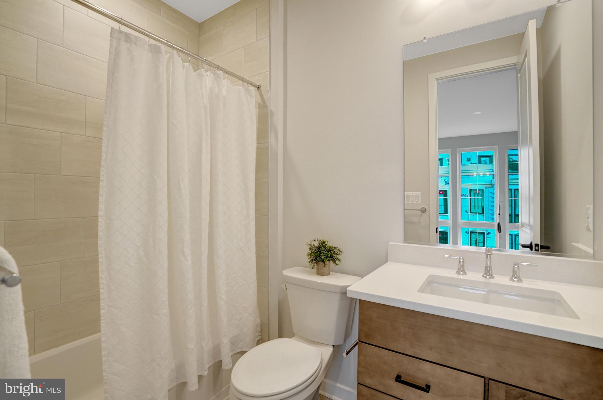 2605 Fall Line Street Alexandria, VA 22301 - Photo 51 of 71 a bathroom with a sink vanity mirror and toilet