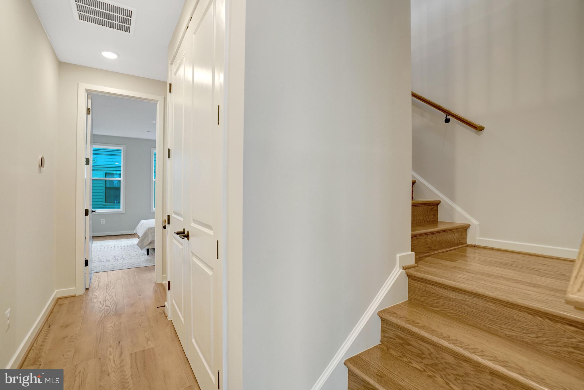 2605 Fall Line Street Alexandria, VA 22301 - Photo 52 of 71 a view of a hallway with wooden floor and entryway