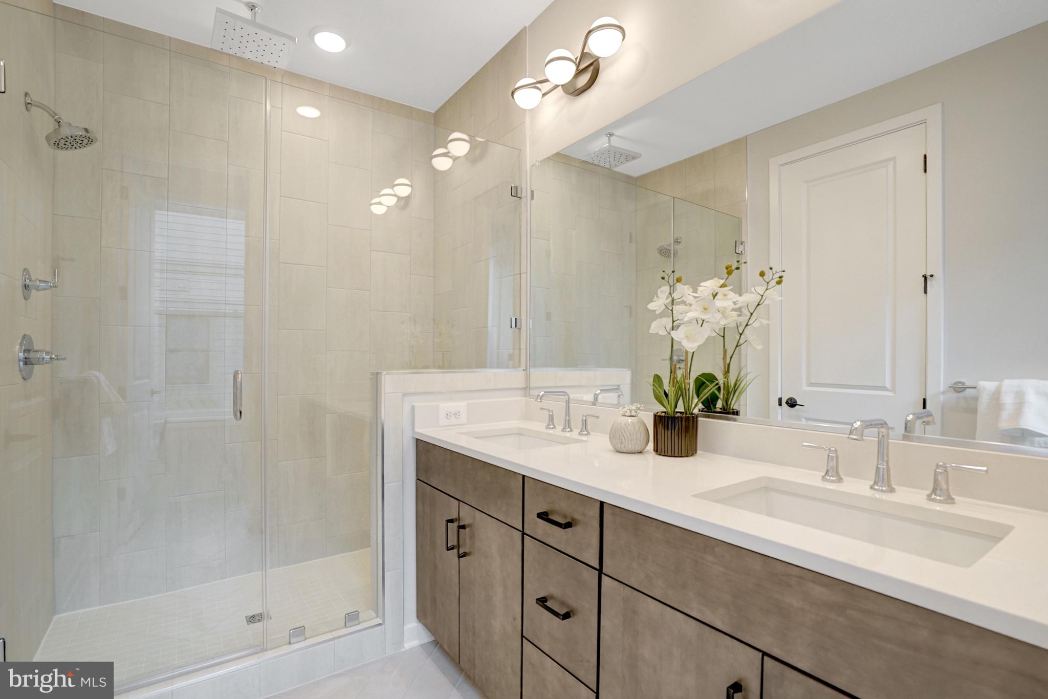 2605 Fall Line Street Alexandria, VA 22301 - Photo 57 of 71 a bathroom with double sink and a mirror
