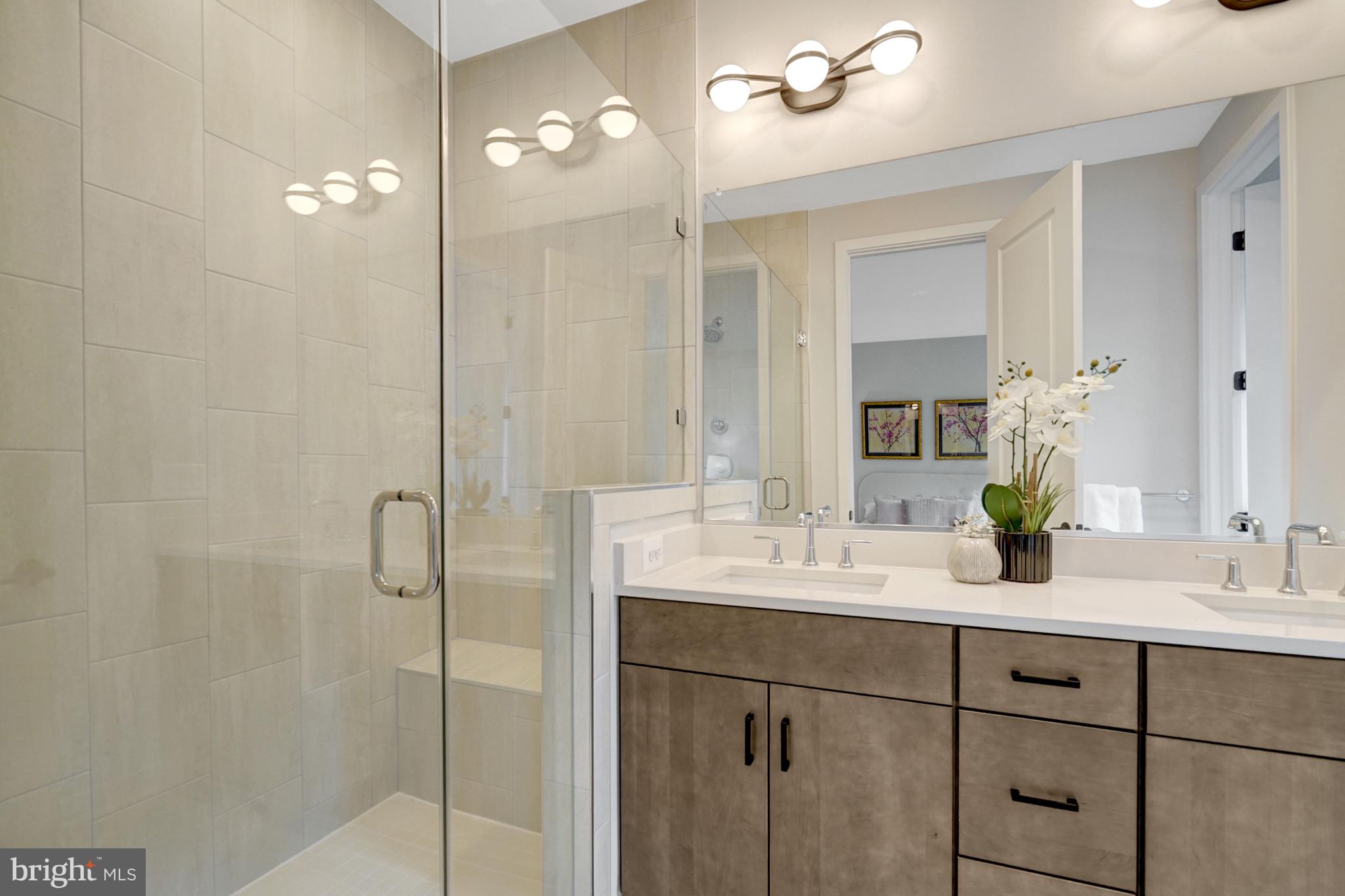2605 Fall Line Street Alexandria, VA 22301 - Photo 58 of 71 a bathroom with a double vanity sink and a mirror