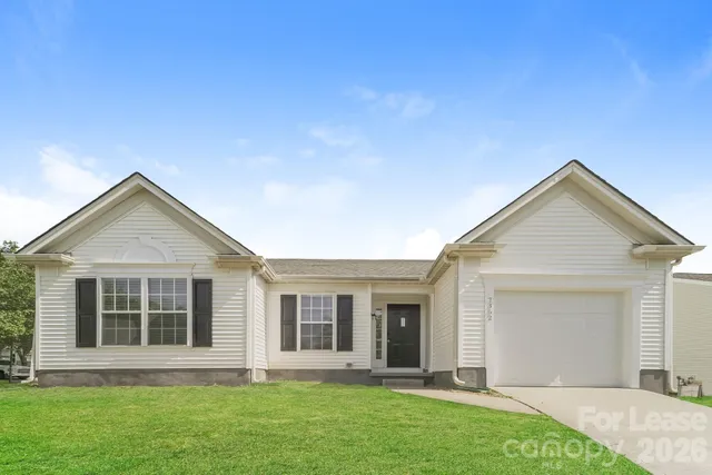 front view of a house with a yard