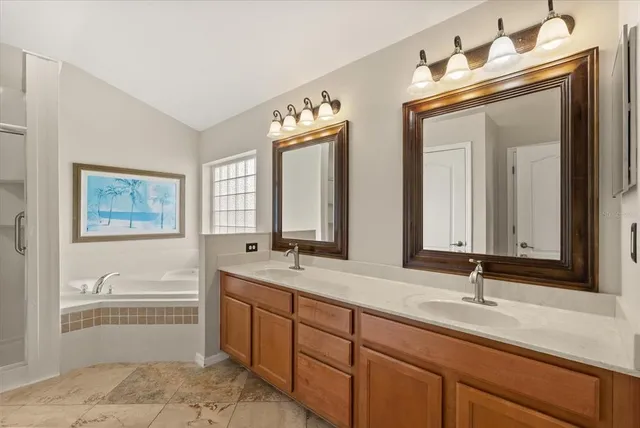a bathroom with a tub and a window