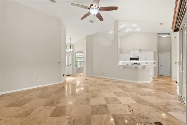 a view of a kitchen with a sink and cabinets