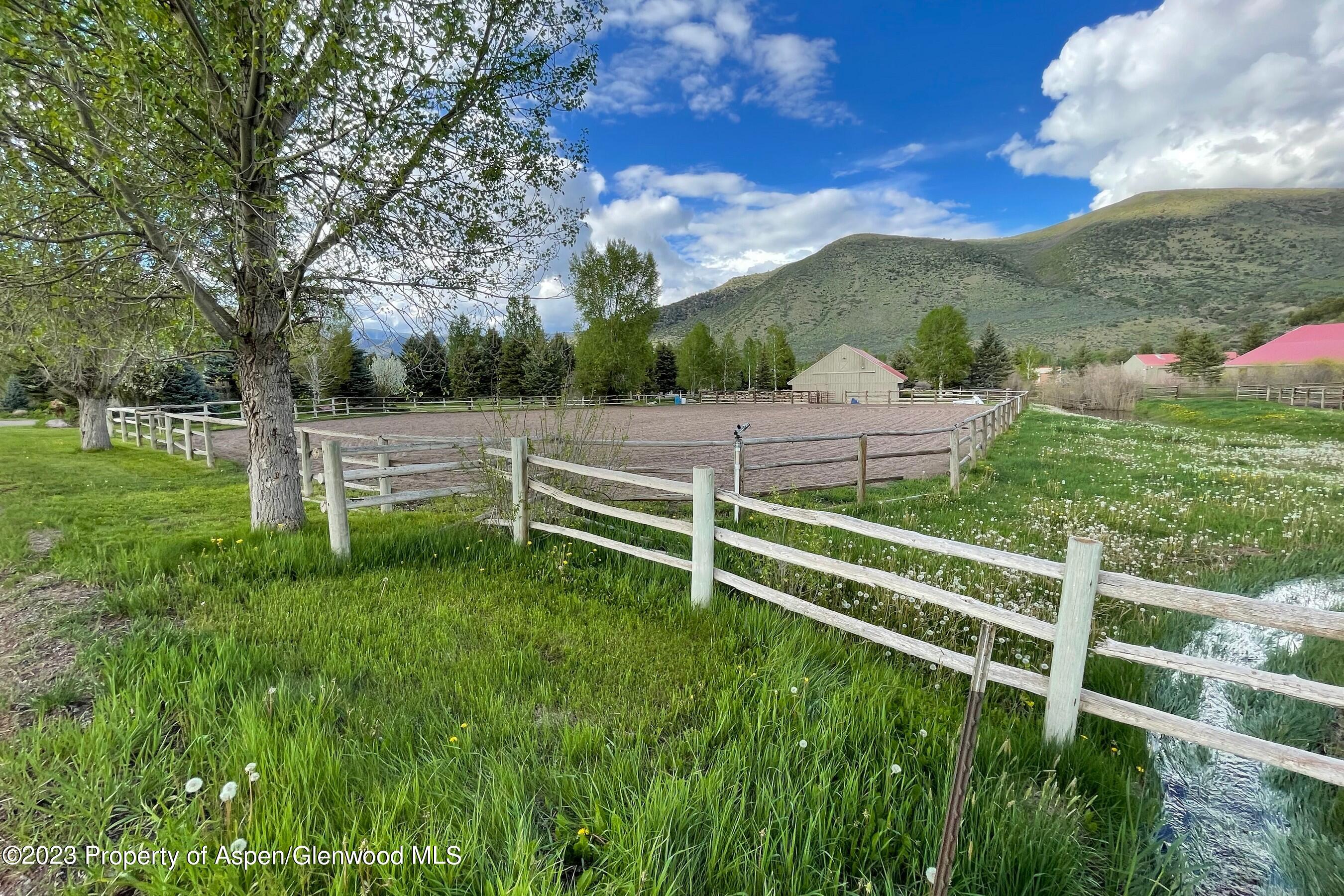 0 Lazy O Road, Unit LOT #4 Snowmass, CO 81654 - Photo 15 of 25 a view of a garden with an outdoor space