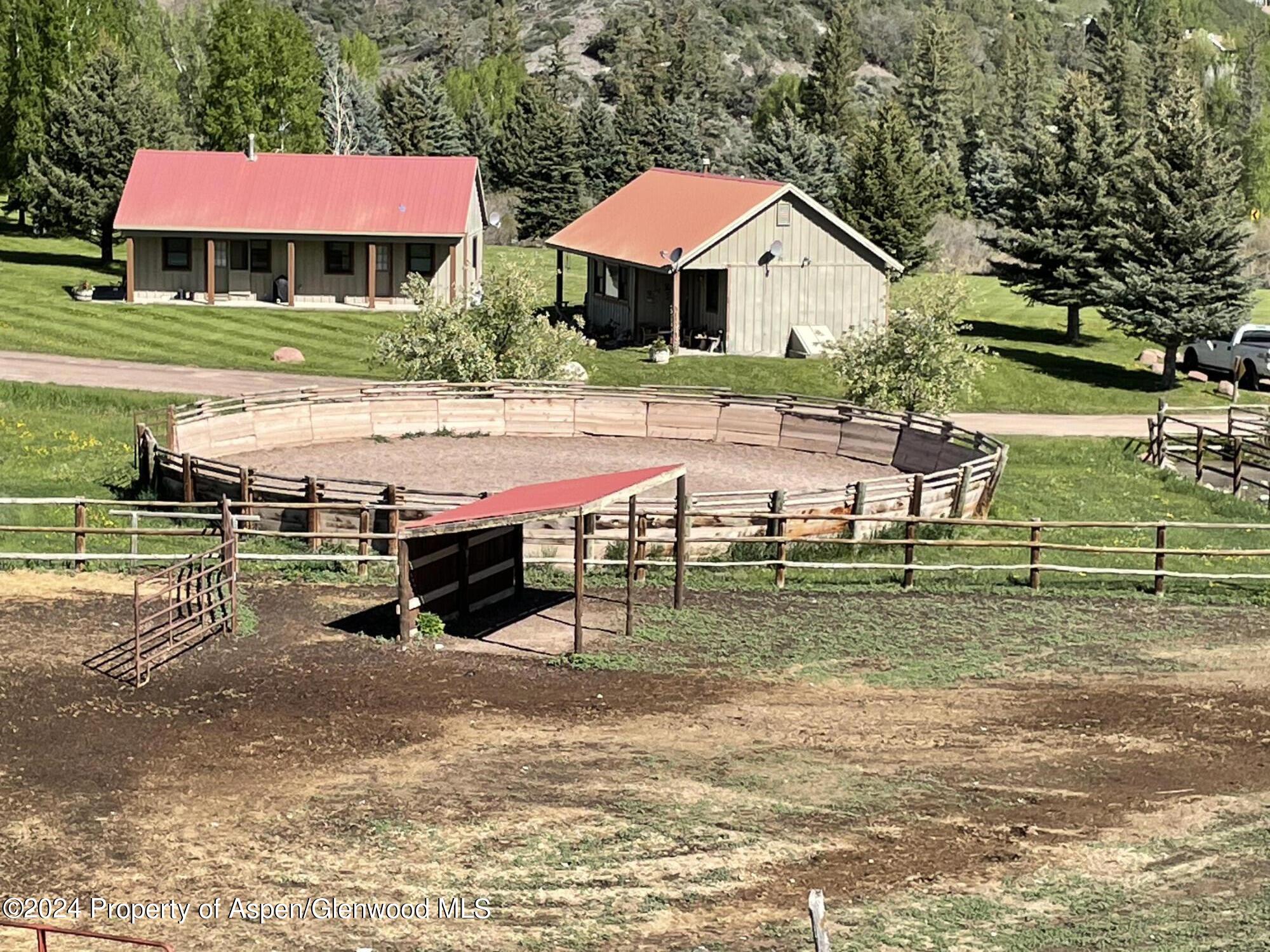 0 Lazy O Road, Unit LOT #4 Snowmass, CO 81654 - Photo 16 of 25 a view of a house with a yard porch and sitting area