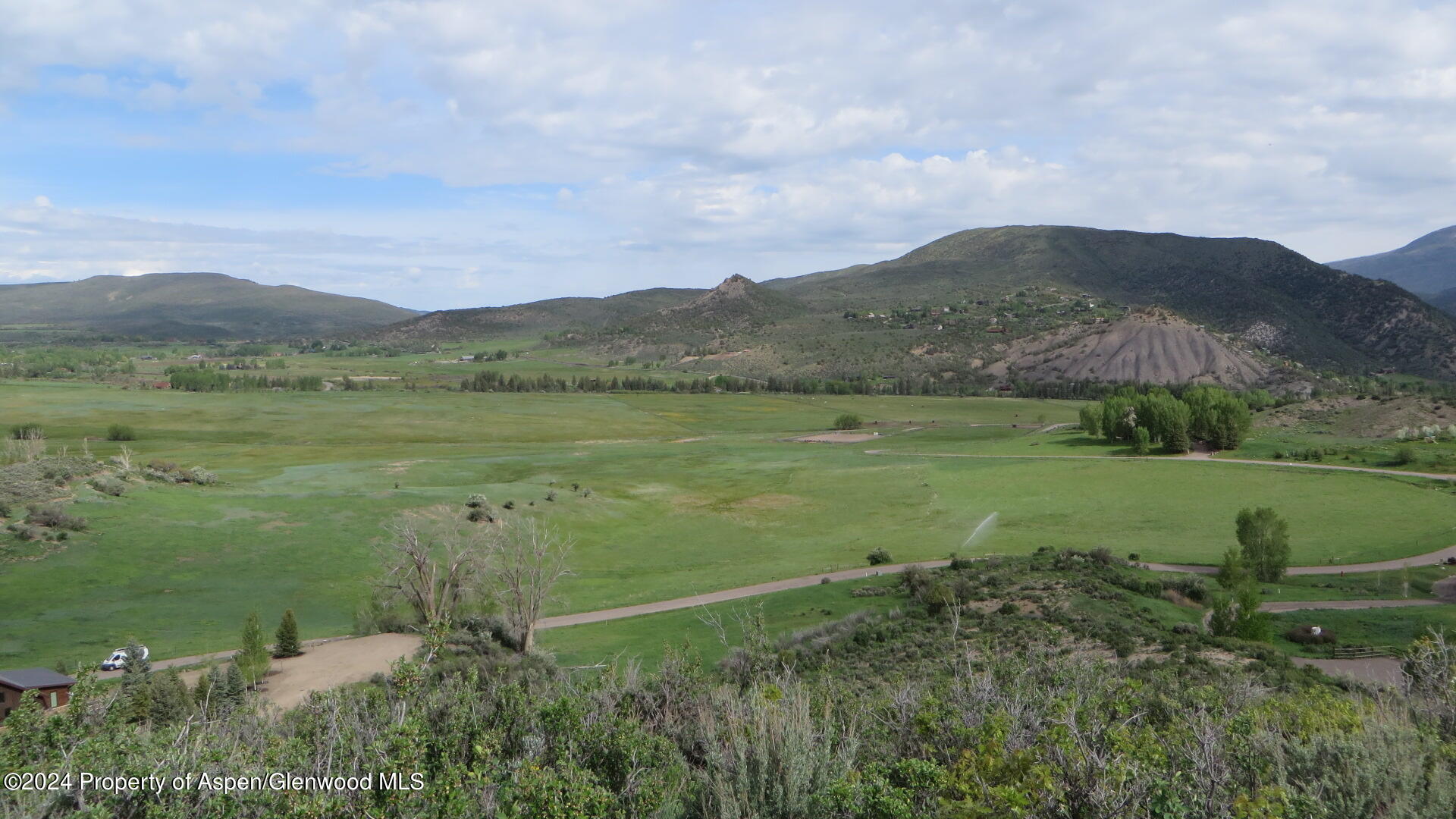 0 Lazy O Road, Unit LOT #4 Snowmass, CO 81654 - Photo 3 of 25 a view of a lake with a mountain in the background