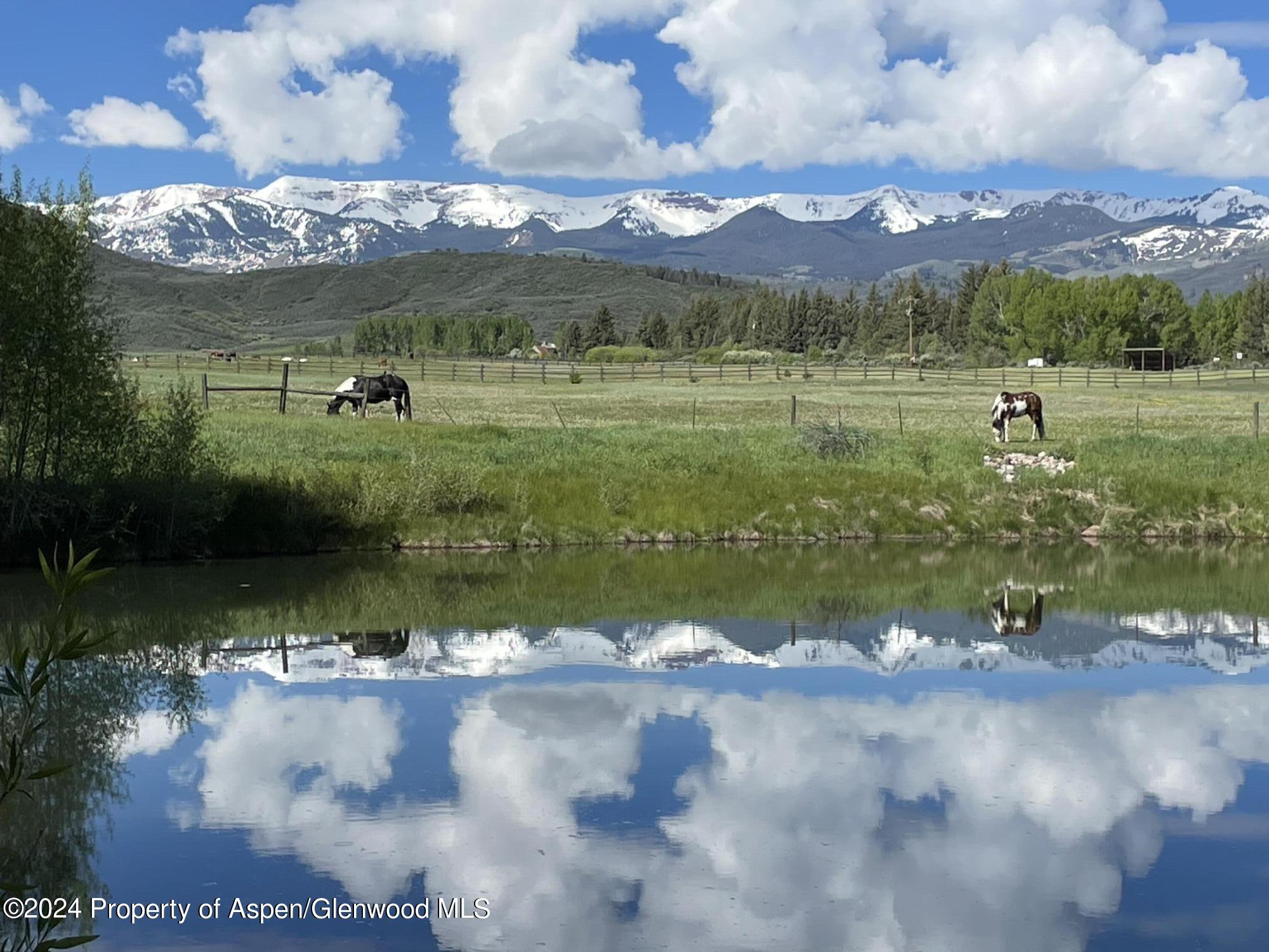 0 Lazy O Road, Unit LOT #4 Snowmass, CO 81654 - Photo 4 of 25 a view of a lake in middle of the town