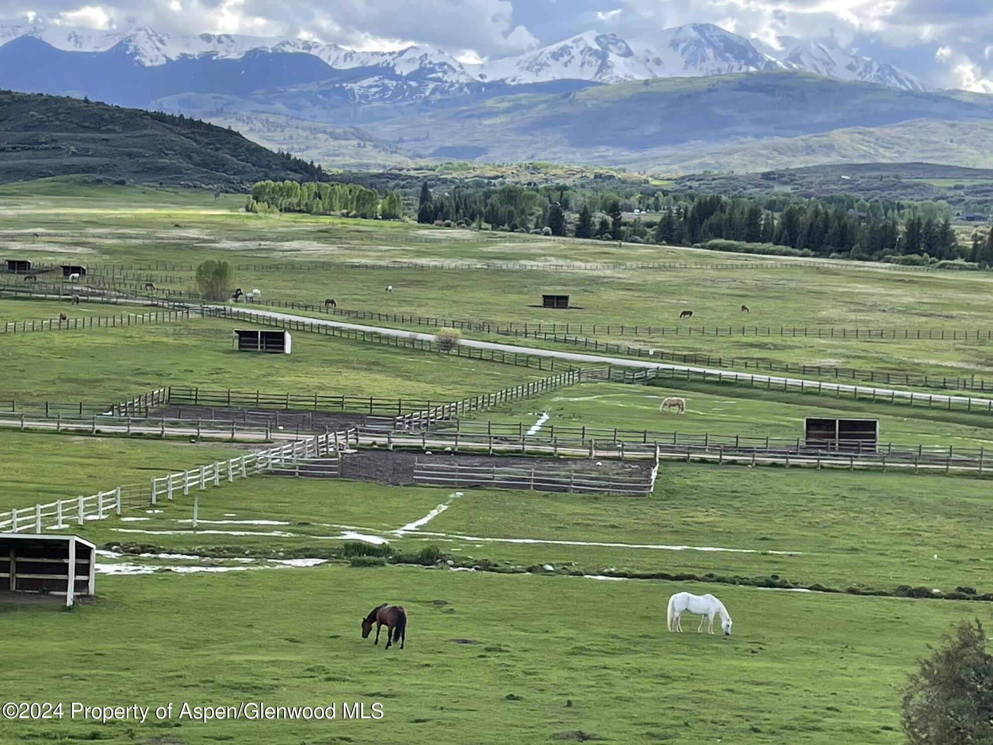 0 Lazy O Road, Unit LOT #4 Snowmass, CO 81654 - Photo 8 of 25 a view of a golf course with a ocean view