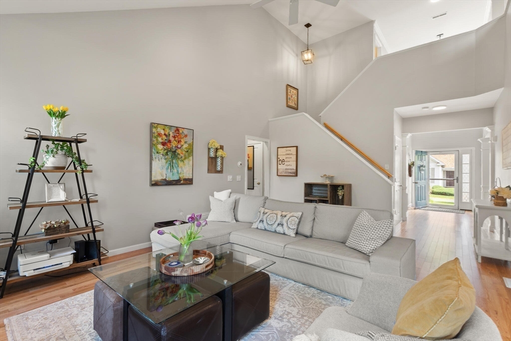 27 Brook Lane, Unit 27 Berlin, MA 01503 - Photo 16 of 36 a living room with furniture and wooden floor