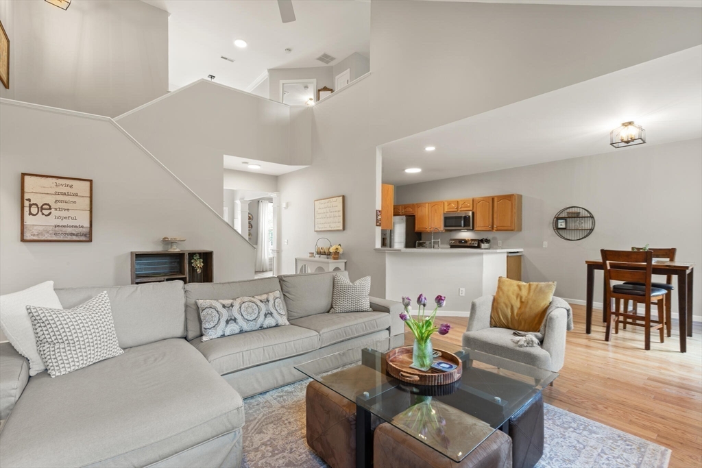 27 Brook Lane, Unit 27 Berlin, MA 01503 - Photo 17 of 36 a living room with furniture and kitchen view
