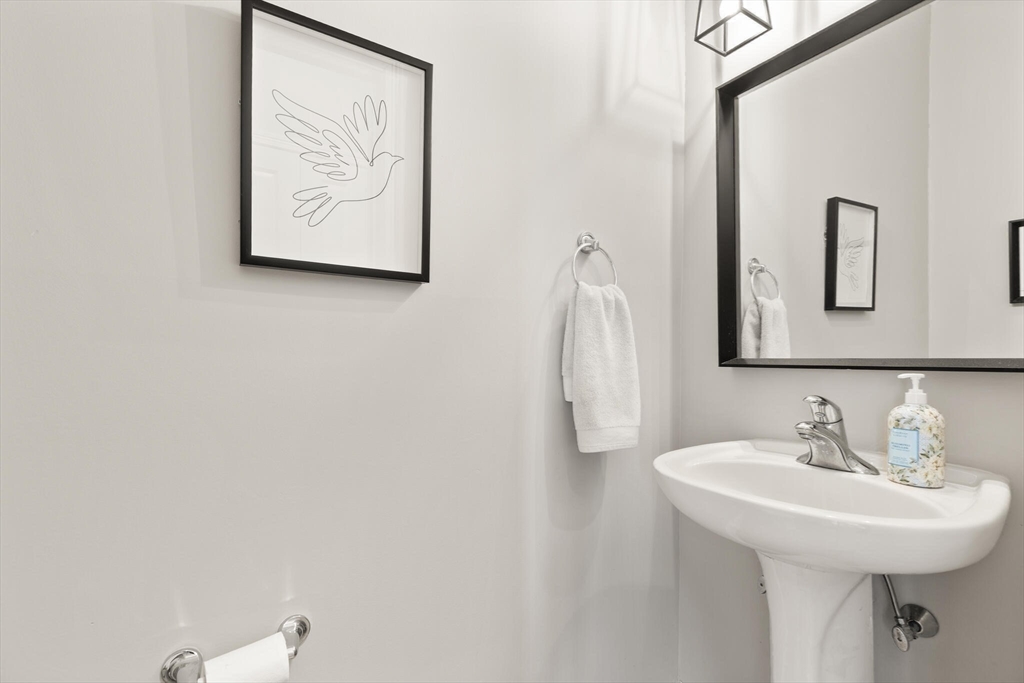 27 Brook Lane, Unit 27 Berlin, MA 01503 - Photo 24 of 36 a bathroom with a sink and a mirror