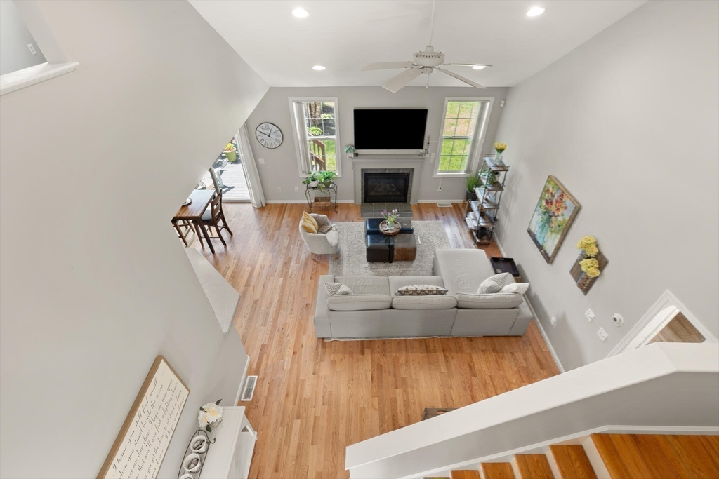 27 Brook Lane, Unit 27 Berlin, MA 01503 - Photo 25 of 36 a living room with furniture and a flat screen tv