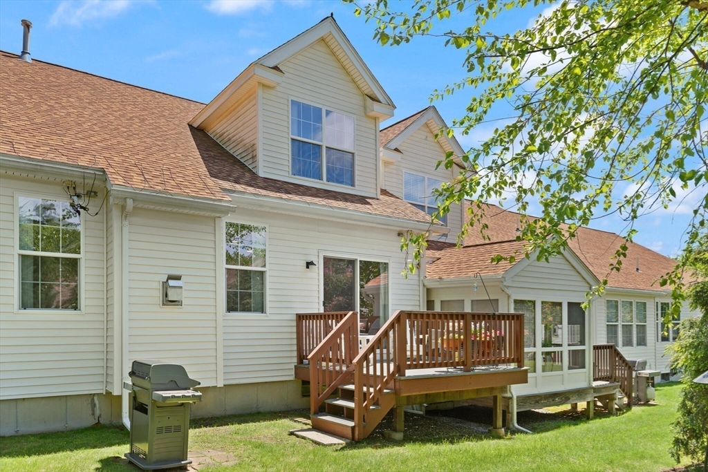 27 Brook Lane, Unit 27 Berlin, MA 01503 - Photo 32 of 36 a view of a house with a yard porch and sitting area
