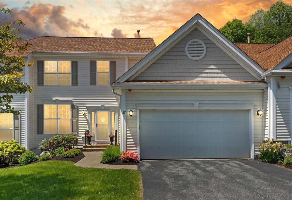 27 Brook Lane, Unit 27 Berlin, MA 01503 - Photo 36 of 36 a view of a house with brick walls and a yard