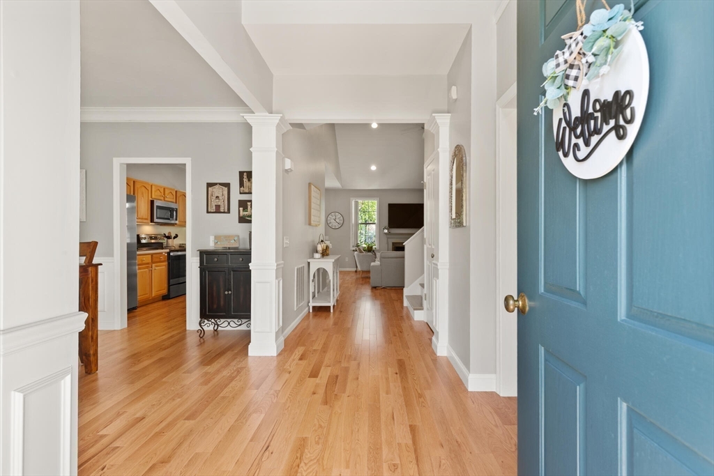 27 Brook Lane, Unit 27 Berlin, MA 01503 - Photo 4 of 36 a view of a hallway with wooden floor