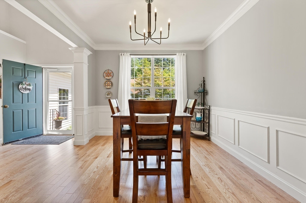27 Brook Lane, Unit 27 Berlin, MA 01503 - Photo 6 of 36 a view of a dining room with furniture window and wooden floor