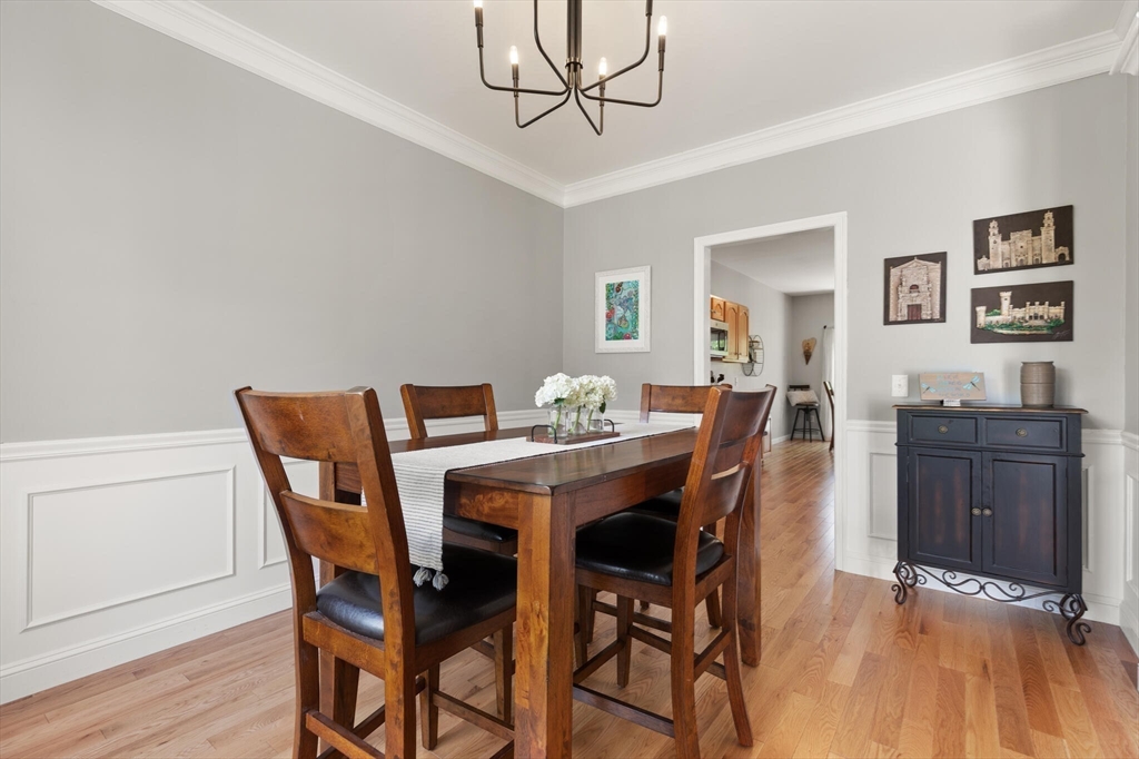 27 Brook Lane, Unit 27 Berlin, MA 01503 - Photo 8 of 36 a view of a dining room with furniture and wooden floor
