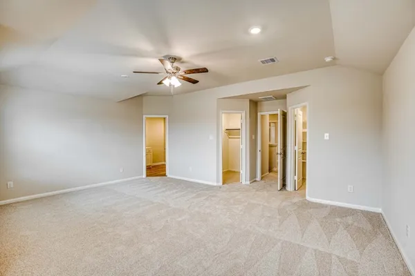 a view of an empty room with a bathroom