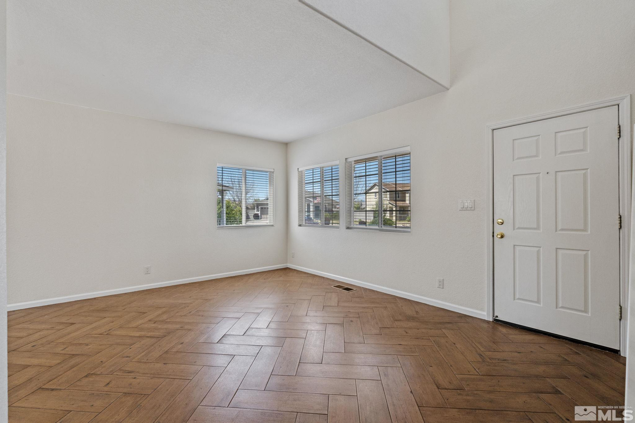 10015 Stonefield Drive Reno, NV 89521 - Photo 3 of 35 a view of an empty room with a window