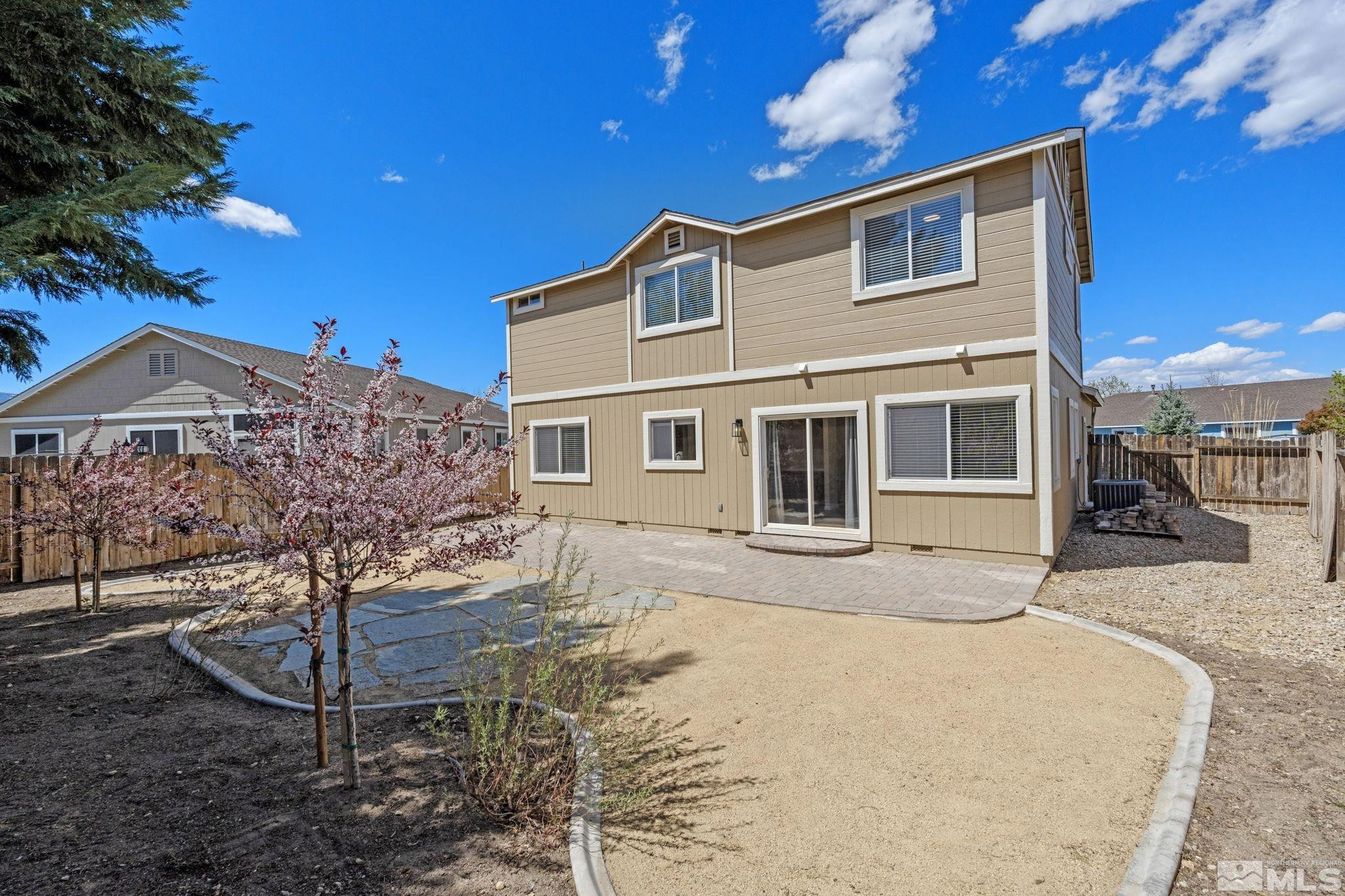 10015 Stonefield Drive Reno, NV 89521 - Photo 31 of 35 a front view of a house with garden