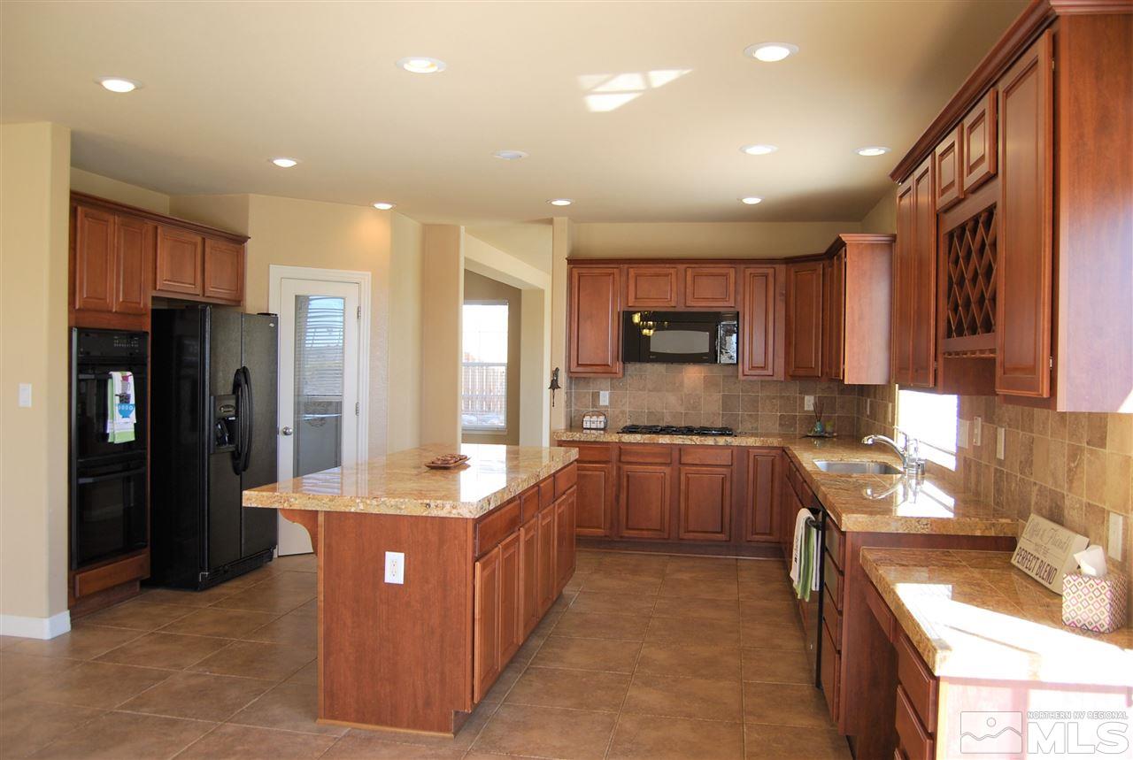 2900 Sandestin Drive Reno, NV 89523 - Photo 11 of 24 a large kitchen with stainless steel appliances lots of counter top space