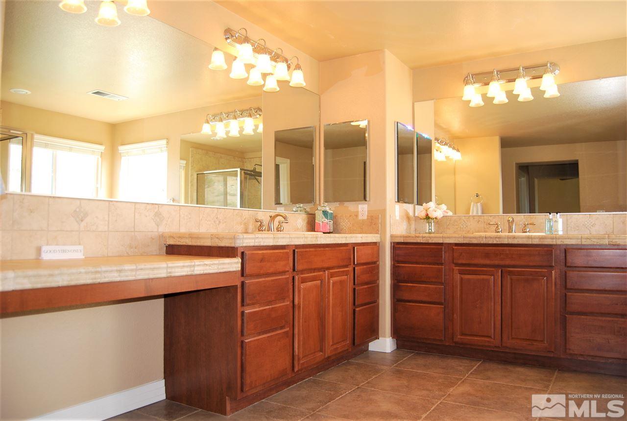 2900 Sandestin Drive Reno, NV 89523 - Photo 18 of 24 a bathroom with a sink vanity and a mirror