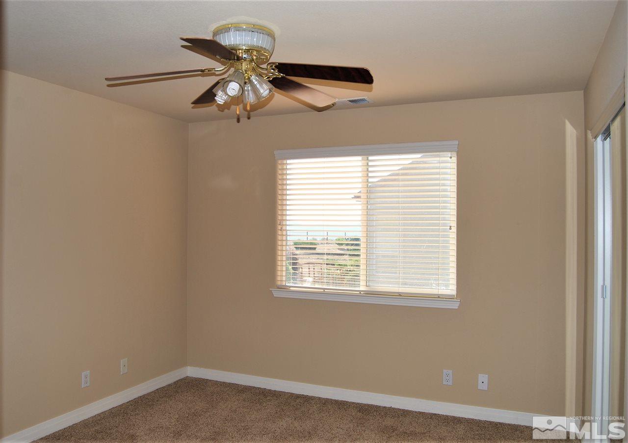 2900 Sandestin Drive Reno, NV 89523 - Photo 22 of 24 a view of wooden floor and a chandelier fan in a room
