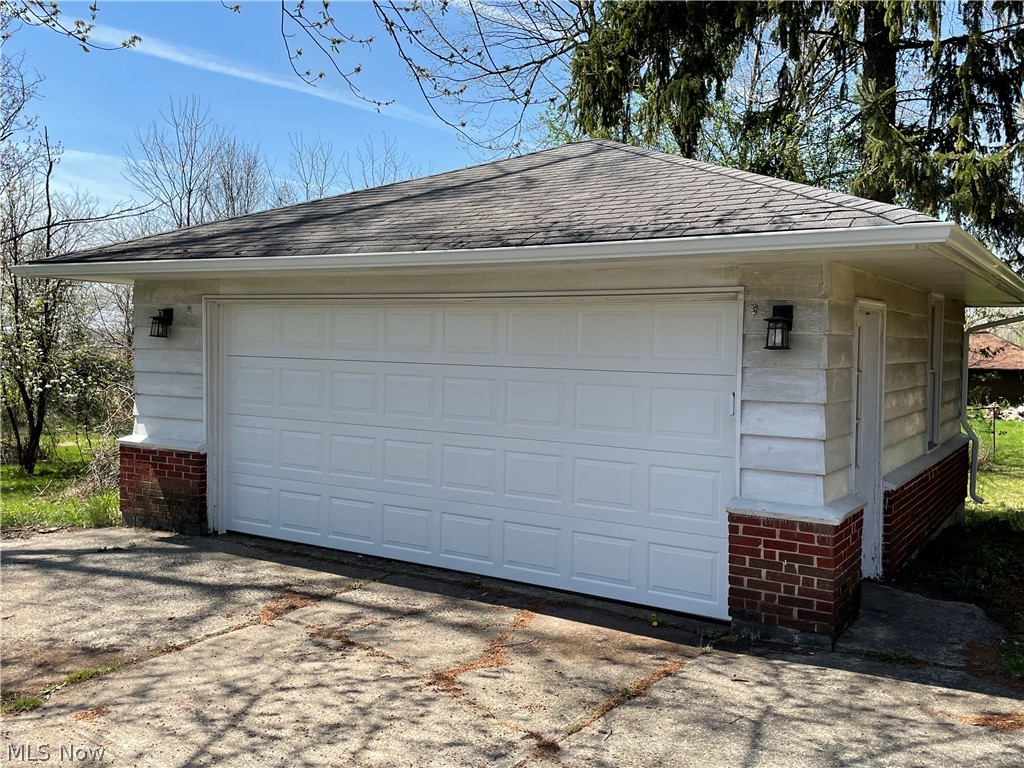 24800 Emery Road Warrensville Heights, OH 44128 - Photo 3 of 17 Two car garage with new door and opener