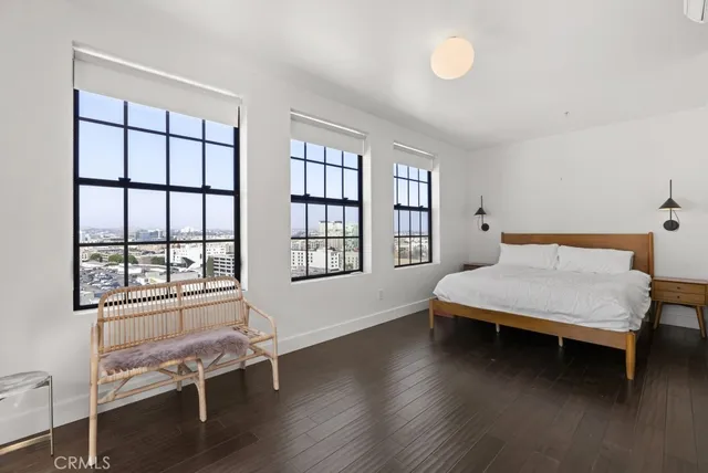 a room that has a chair and a window in it