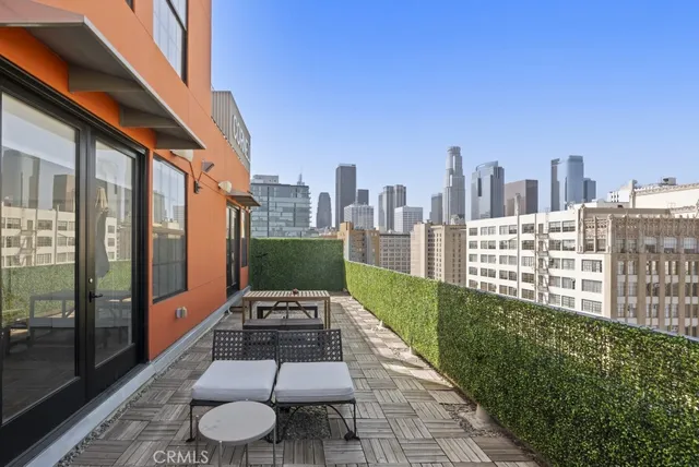 a view of a terrace with chairs and a table