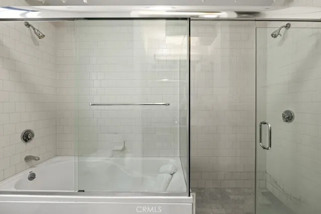a bathroom with a granite countertop sink toilet and mirror