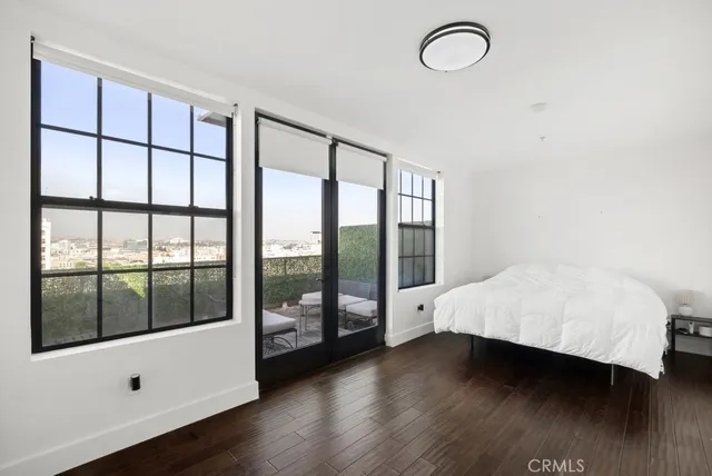 a view of an entryway with wooden floor and garden view