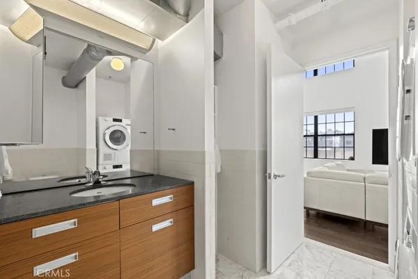 a kitchen with kitchen island a stove a sink and a microwave