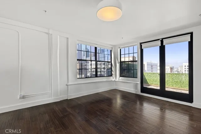 a kitchen with kitchen island granite countertop a stove a sink and a microwave