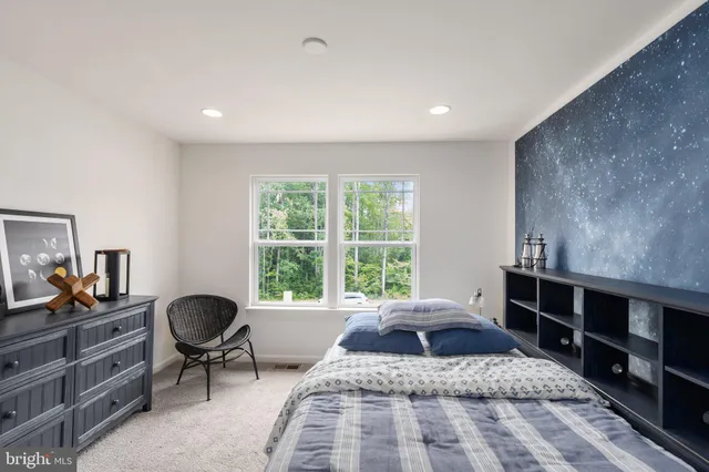 a bed room with a bed and a window