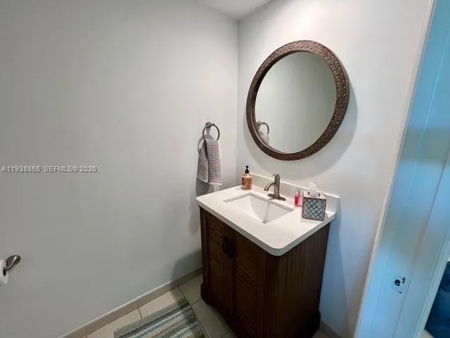 a view of a room with gym equipment and potted plants