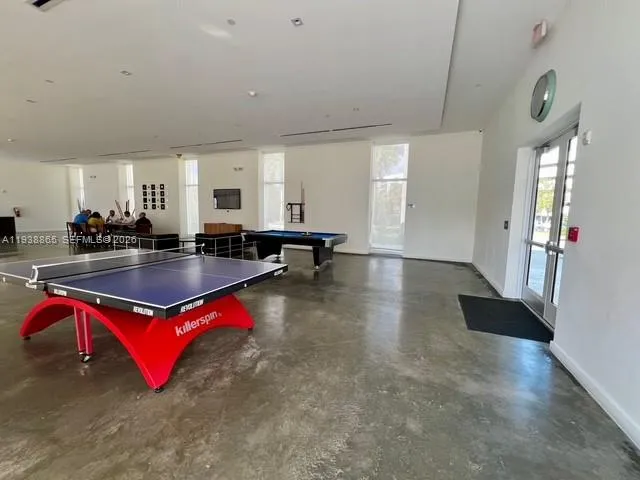 a view of a large building with a yard