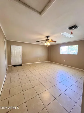 a view of an empty room and window
