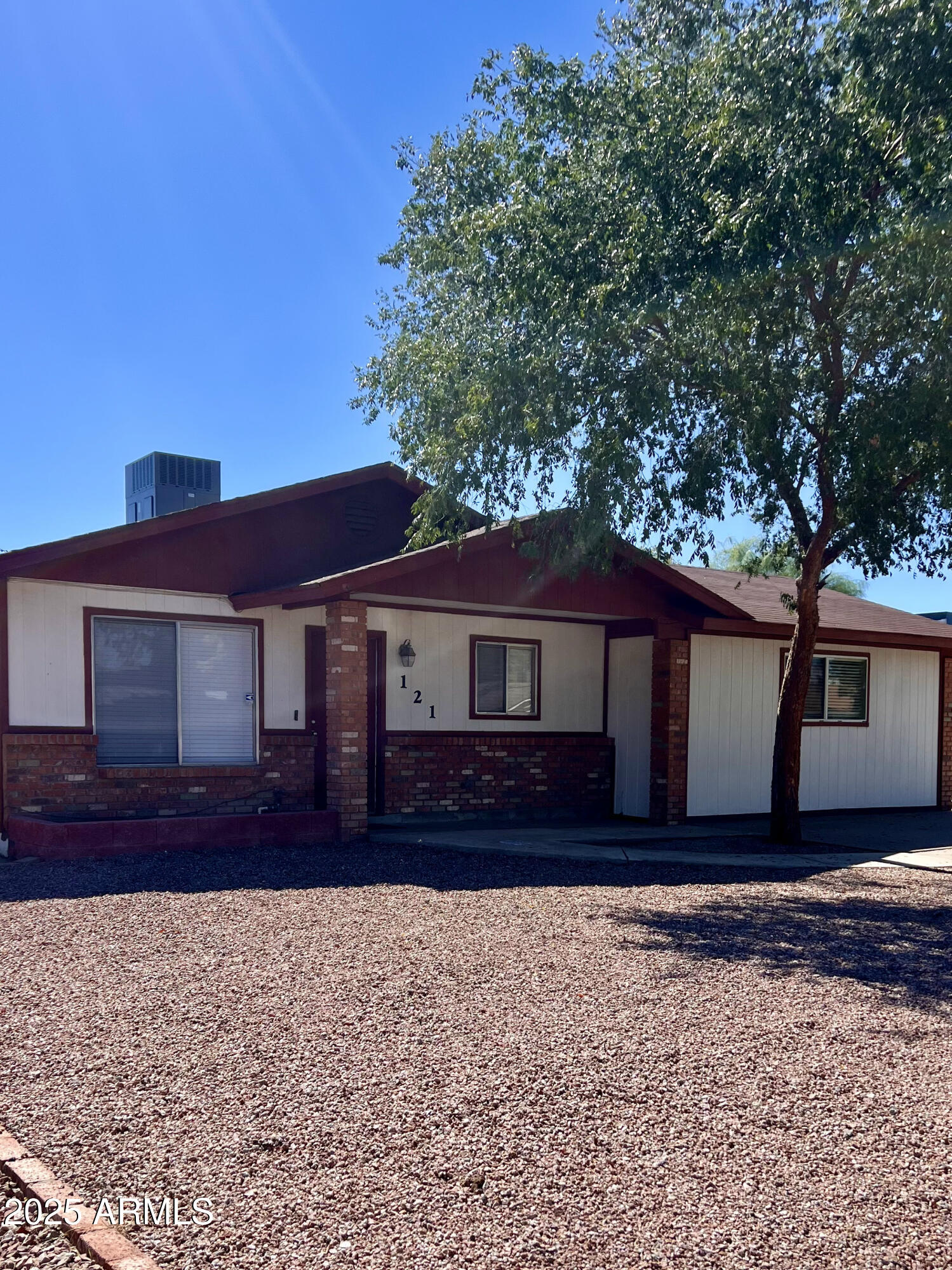 121 East Olive Avenue Gilbert, AZ 85234 - Photo 2 of 25 a front view of a house with a yard