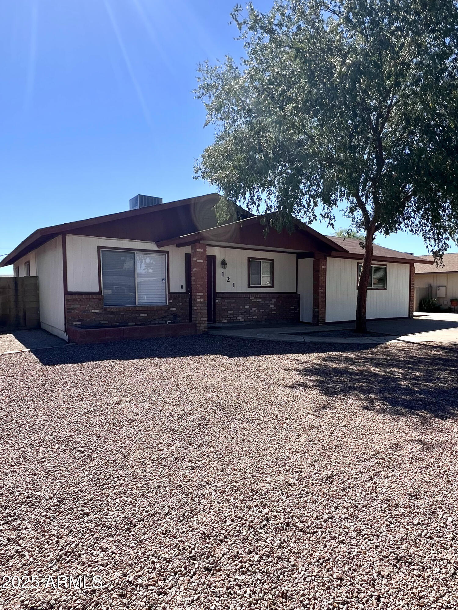 121 East Olive Avenue Gilbert, AZ 85234 - Photo 3 of 25 a front view of a house with a yard