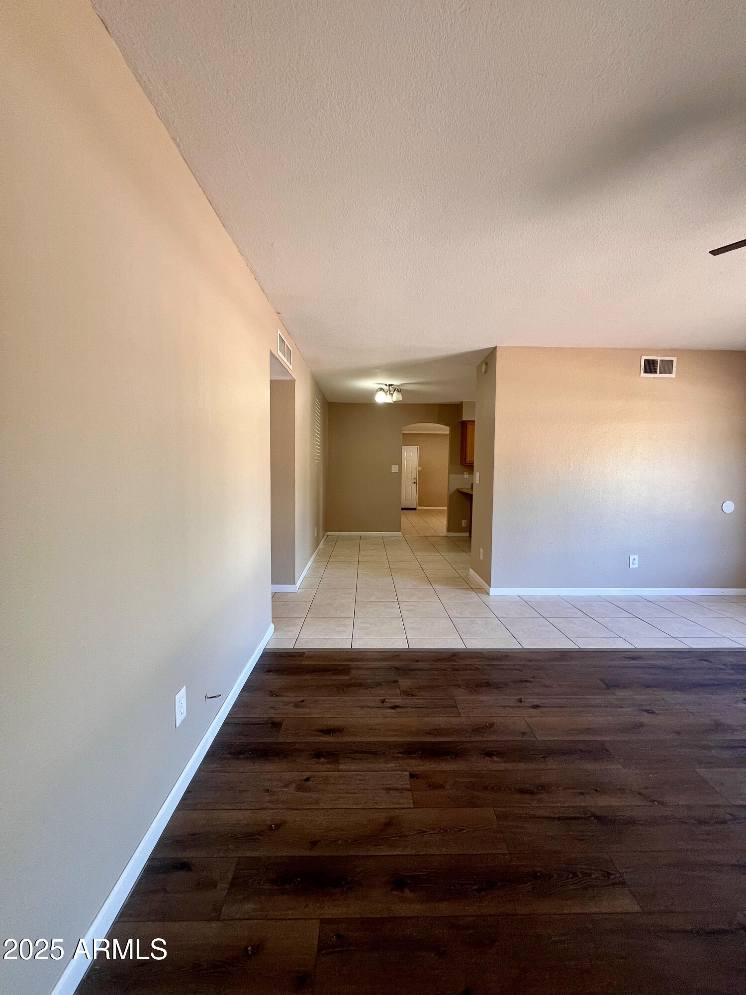 121 East Olive Avenue Gilbert, AZ 85234 - Photo 9 of 25 a view of a hallway with wooden floor