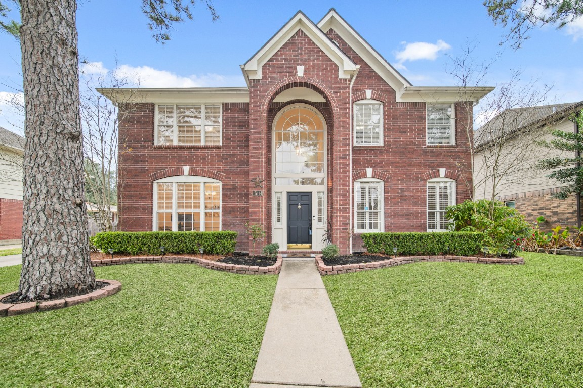 16114 Kintyre Point Road Houston, TX 77095 - Photo 2 of 41 a front view of a house with garden