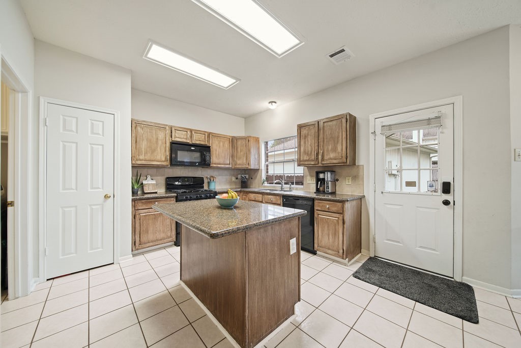 16114 Kintyre Point Road Houston, TX 77095 - Photo 23 of 41 a kitchen with a sink a counter top space and stainless steel appliances
